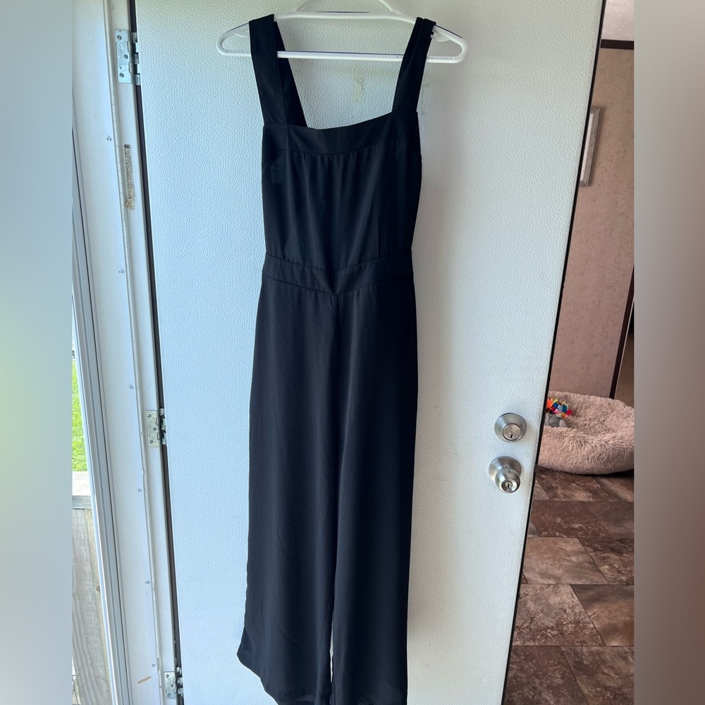 Black pants jumpsuit size large, open back w/bow tie.
